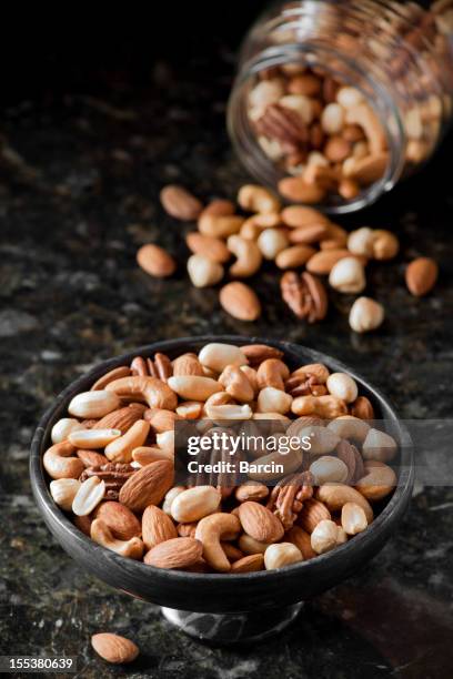 mixed nuts - dry fruits stock pictures, royalty-free photos & images