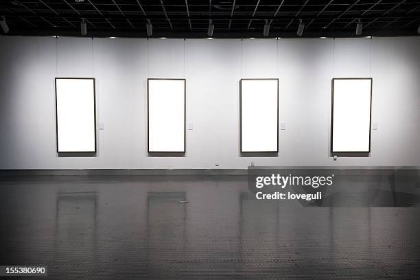 empty frame at the museum - museum wall stock pictures, royalty-free photos & images