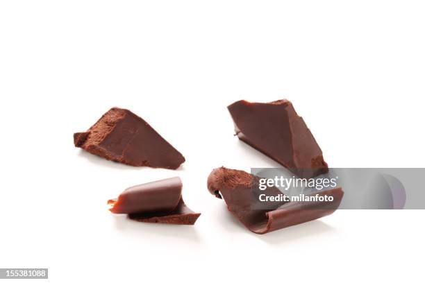 chocolate curls isolated on white - chocolate shaving stock pictures, royalty-free photos & images