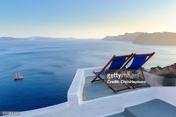 two deck chairs with view, santorini, greece - santorini stock pictures, royalty-free photos & images