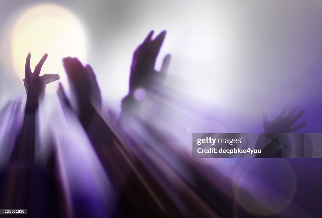 Abstract blurred hands in light