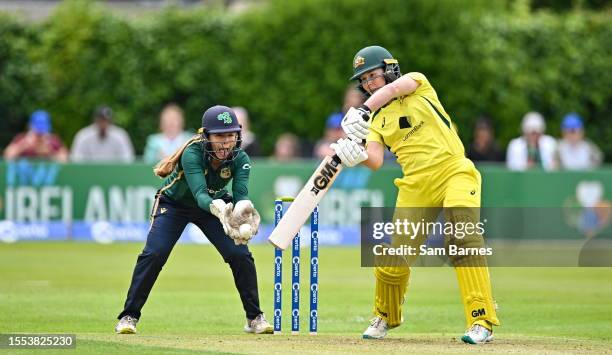 Dublin , Ireland - 25 July 2023; Georgia Wareham of Australia bats watch by Ireland wicketkeeper Amy Hunter during match two of the Certa Women's One...