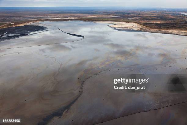 tailings pond - oil sands stock-fotos und bilder