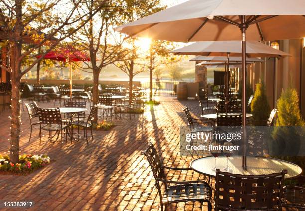 lovely summer patio setting in restaurant. - restaurant patio stockfoto's en -beelden