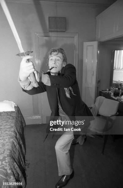 English actor Peter O'Toole poses for a portrait in his dressing room at the Old Vic while playing in Macbeth in 1980 in London, UK.