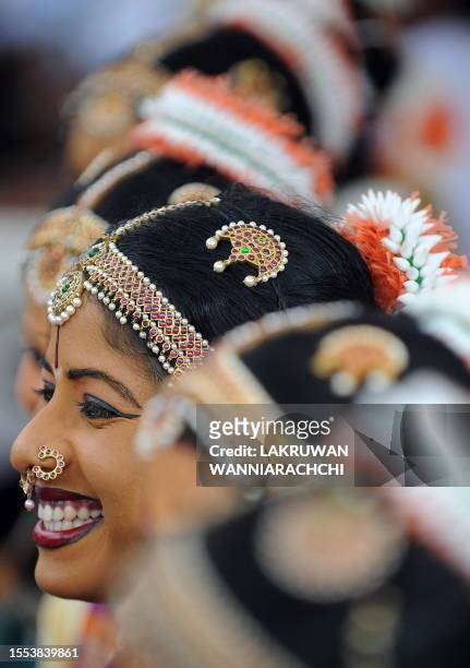 Sri Lankan school girls perform dances during the Tamil religious festival of Thai Pongal held in the northern town of Jaffna on January 17, 2011....