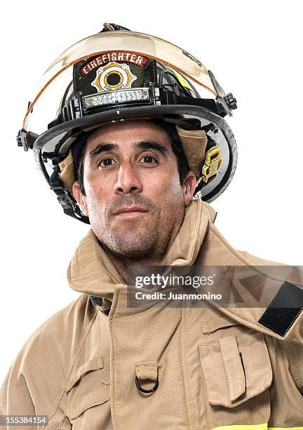 mature hispanic fireman (real people) - firefighter hat stock pictures, royalty-free photos & images