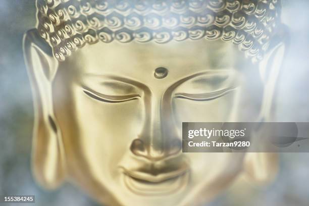 closeup of buddha statue - buddha face stock pictures, royalty-free photos & images
