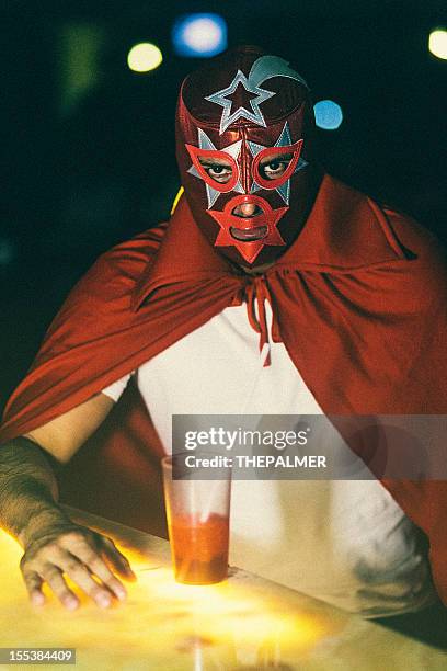 mexican luchador at a bar - lucha libre stock pictures, royalty-free photos & images