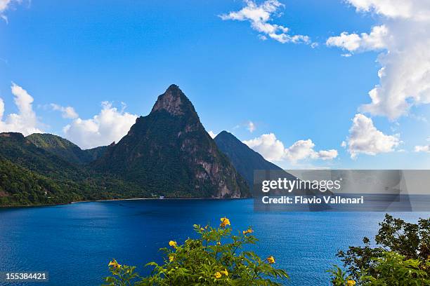 view of pitons, st. lucia depicting mountains and the ocean - saint lucia stock pictures, royalty-free photos & images