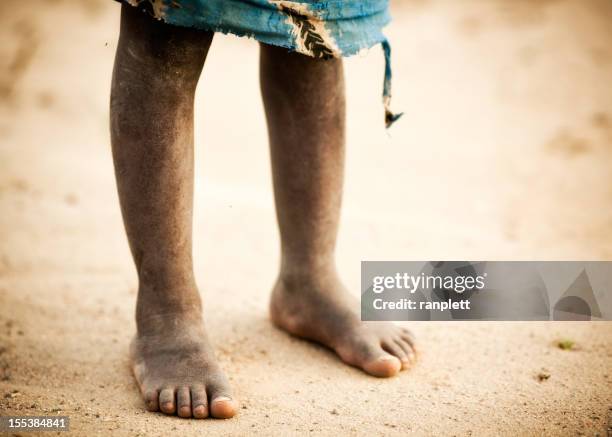 the dusty feet of an african boy - barefoot stock pictures, royalty-free photos & images