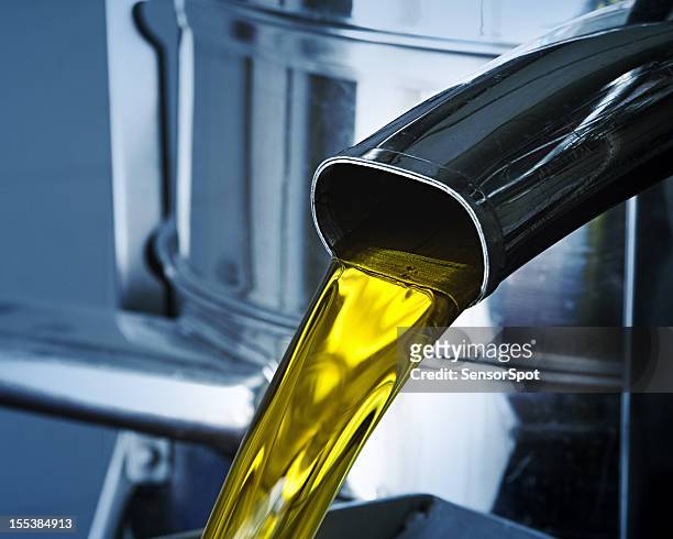 olive oil production - oil flow stockfoto's en -beelden