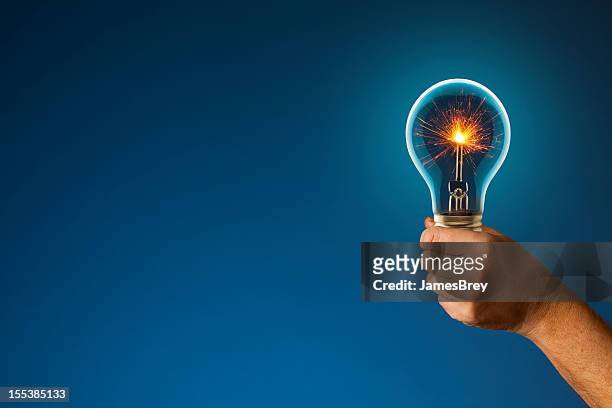 sparkling new idea lighting the way forward - patent stock pictures, royalty-free photos & images