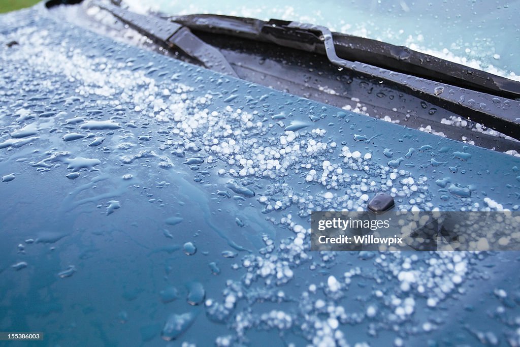 Hailstones Melting on Car Hood