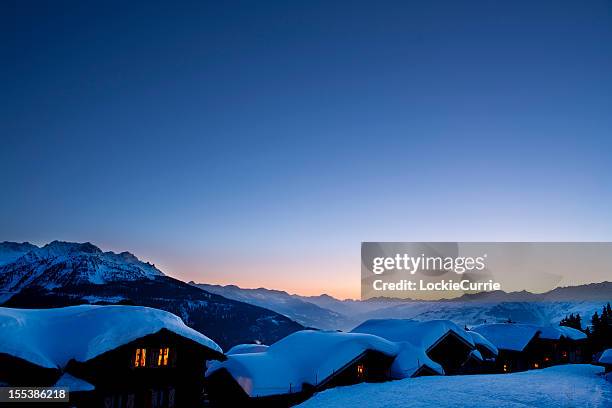 winters sunset - snowy village stock pictures, royalty-free photos & images