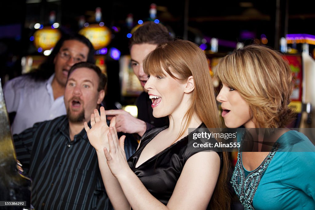 Winners: friends excited about hitting a jackpot in the casino