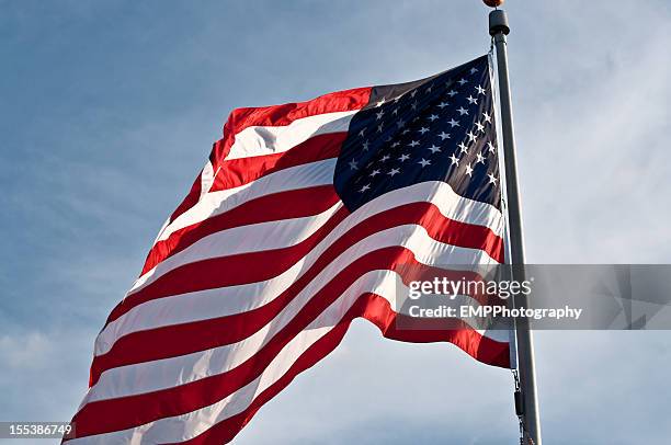 american flag waving in the wind - flag day stock pictures, royalty-free photos & images