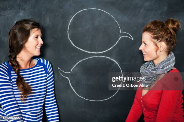 designers in front of a blackboard - chalk wall stock pictures, royalty-free photos & images