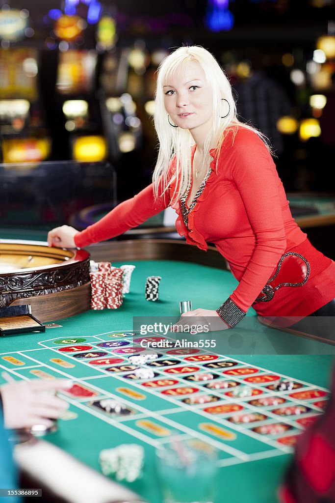 Casino dealer at the roullete table