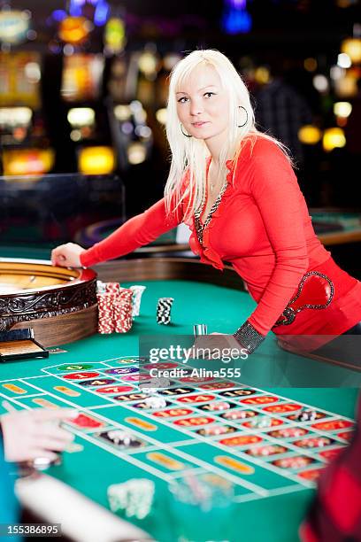 casino dealer at the roullete table - roulette croupier stock pictures, royalty-free photos & images