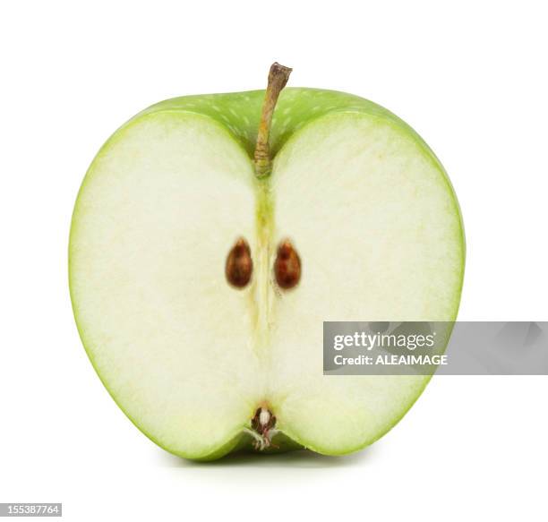 green apple cross section. clipping path included - doorsnede stockfoto's en -beelden