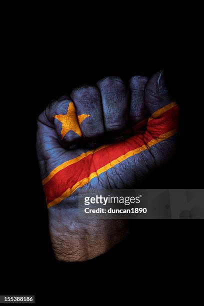 democratic republic of the congo flag fist - democratic republic of the congo stock pictures, royalty-free photos & images