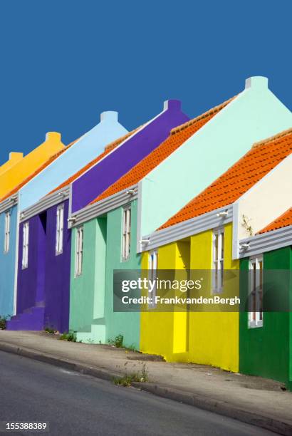 row of colorful caribbean houses - willemstad stock pictures, royalty-free photos & images