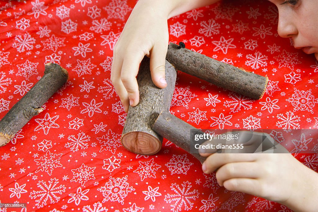 Child making Homemade Reindeer Ornaments