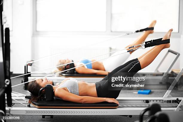 pilates. - reformer stock pictures, royalty-free photos & images