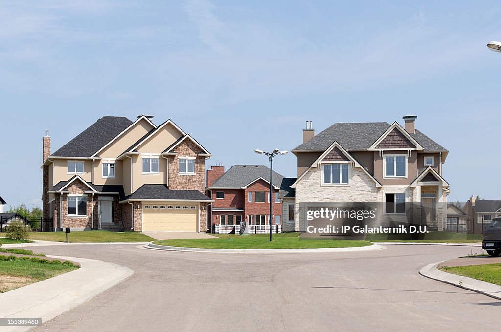 Brand new suburban house in sunny summer afternoon.