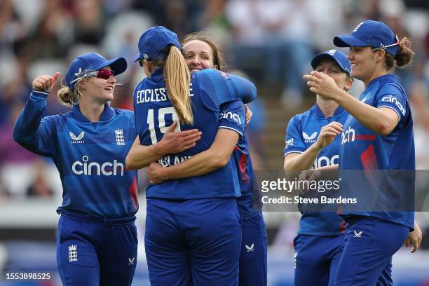 Kate Cross and Sophie Ecclestone of England celebrate with team mates after taking the wicket of Beth Mooney of Australia during the Women's Ashes...