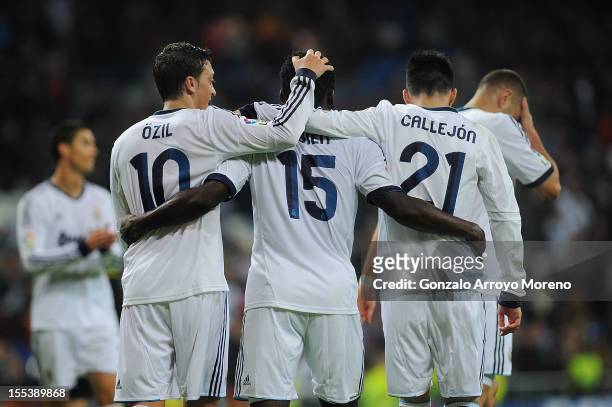 Essien of Real Madrid CF celebrates scoring their third goal with teammate Mezut Ozil , Jose Maria Callejon and Karim Benzema during the La Liga...