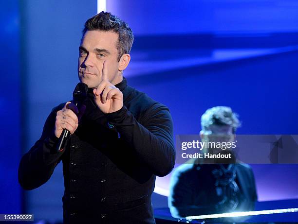 Robbie Williams performs during the 'Wetten dass..?' show on November 3, 2012 in Bremen, Germany.