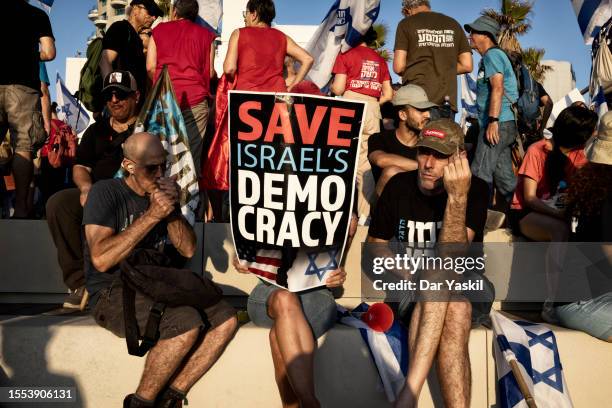 Protestors demonstrate against the judicial reform bill in front of the United States Embassy on July 18, 2023 in Tel Aviv, Israel. Netanyahu's...