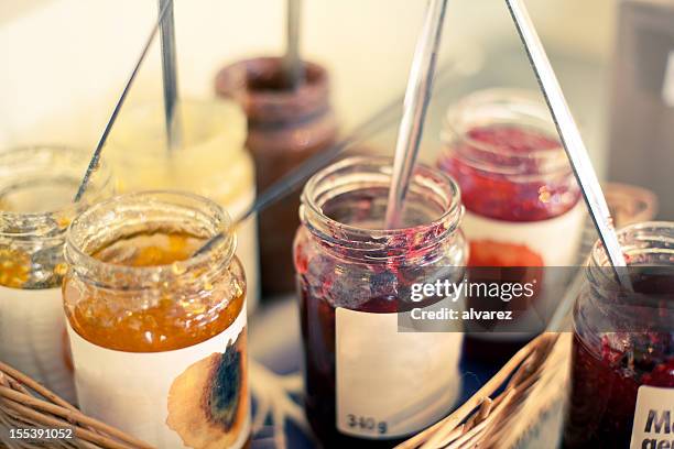 jam jars in a basket - marmalade stock pictures, royalty-free photos & images