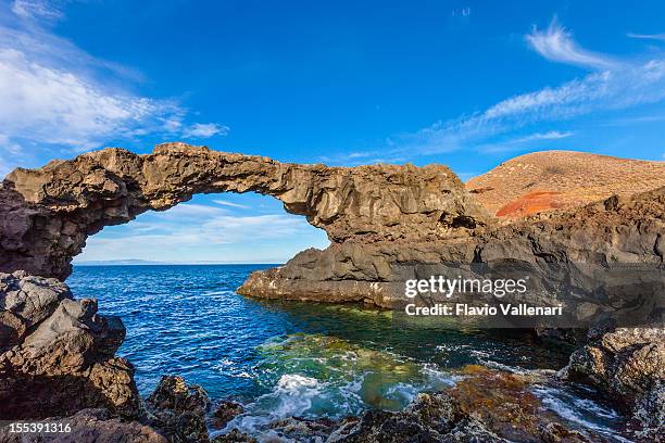 natural stone arch charco manso, el hierro, canary islands - hierro bildbanksfoton och bilder