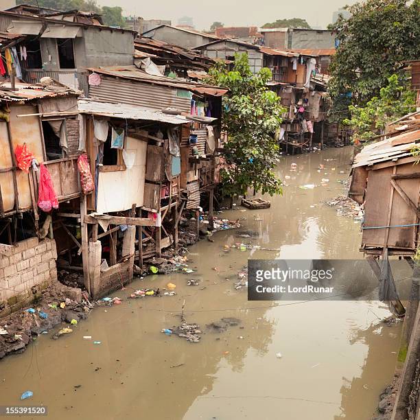 shacks along river - philippines environment pollution water poverty stock pictures, royalty-free photos & images