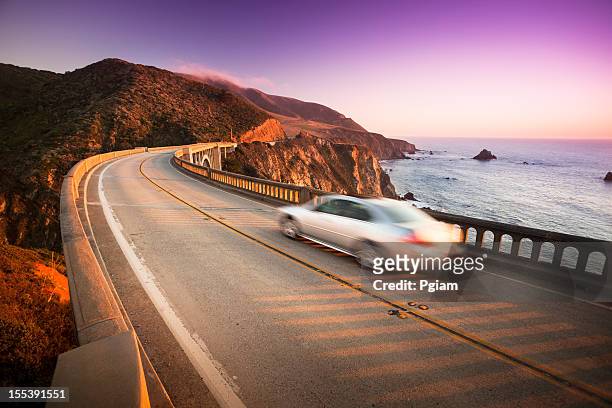 car crossing the bixby bridge, big sur, california, usa - big sur stock pictures, royalty-free photos & images