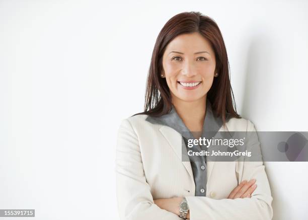 happy mature asian businesswoman - 45 year old woman stock pictures, royalty-free photos & images