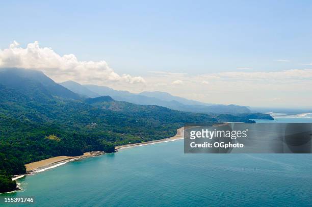 aerial view of tropical forests from mountains to coast. - costa rica stock pictures, royalty-free photos & images