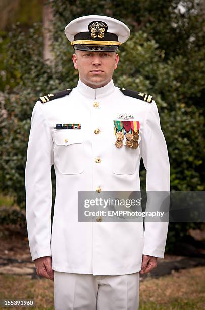 caucasian naval officer standing at attention outside - naval officer stock pictures, royalty-free photos & images