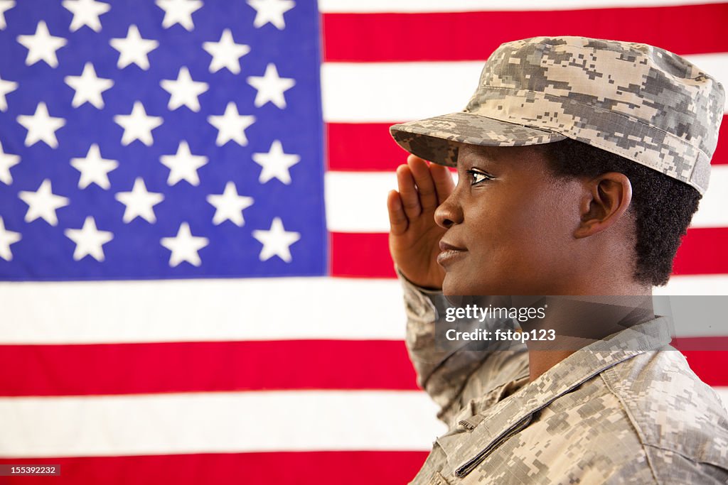 African descent female in military uniform saluting American flag