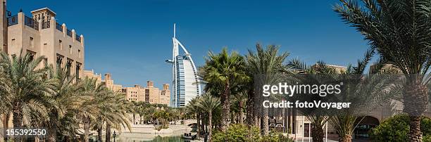 dubai wind towers palm trees burj al arab - dubai water canal stock pictures, royalty-free photos & images