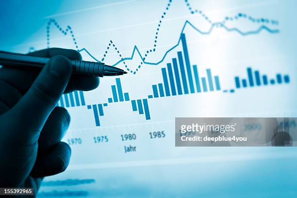 hand pointing with pen on a computer chart / document - control stock pictures, royalty-free photos & images