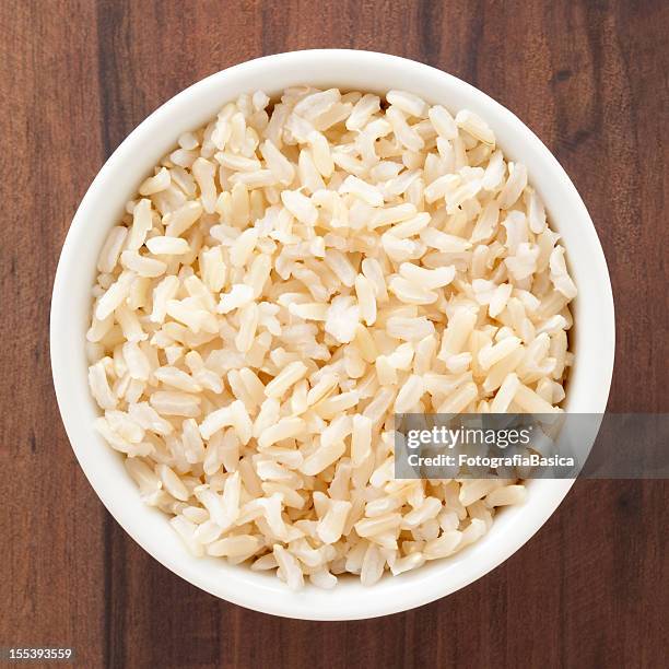 boiled brown rice - brown rice stock pictures, royalty-free photos & images