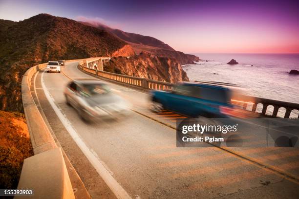 car crossing the bixby bridge, big sur, california, usa - bixby bridge stock pictures, royalty-free photos & images