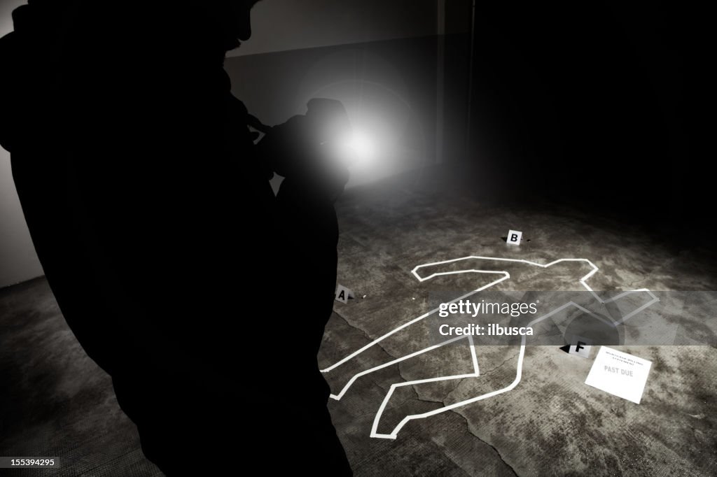 Forensic crime scene, photographer in action