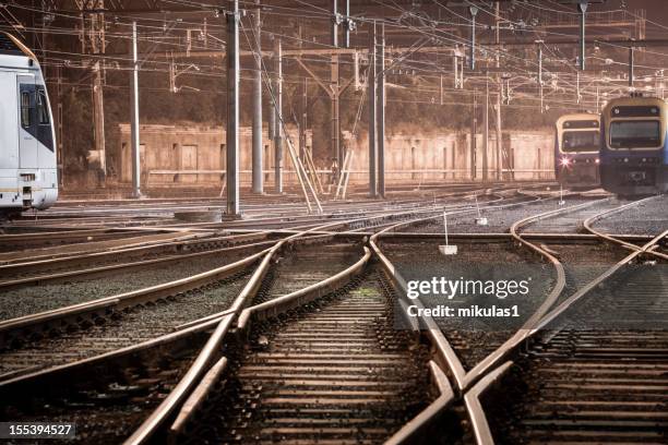 trains at night - train yard at night stock pictures, royalty-free photos & images