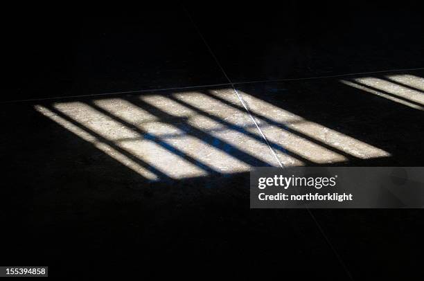 apartheid put the sun behind bars on robben island - racism concept stock pictures, royalty-free photos & images