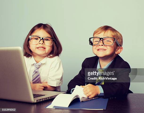 business children at laptop in office - kid chef stockfoto's en -beelden